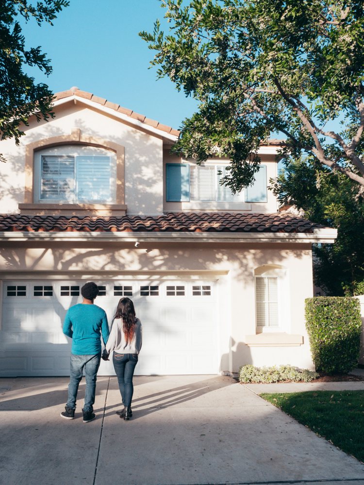 Couple in front of their Florida home